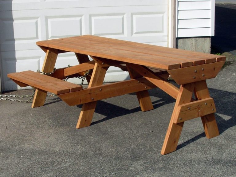 7' Commercial quality Custom Eco Outdoor Hybrid Bench Picnic Table with an extended table slanted right on a sidewalk.
