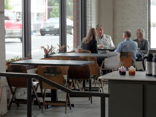 Close up of a dining room with commercial quality Douglas Fir Table Top dining tables at a restaurant bar.