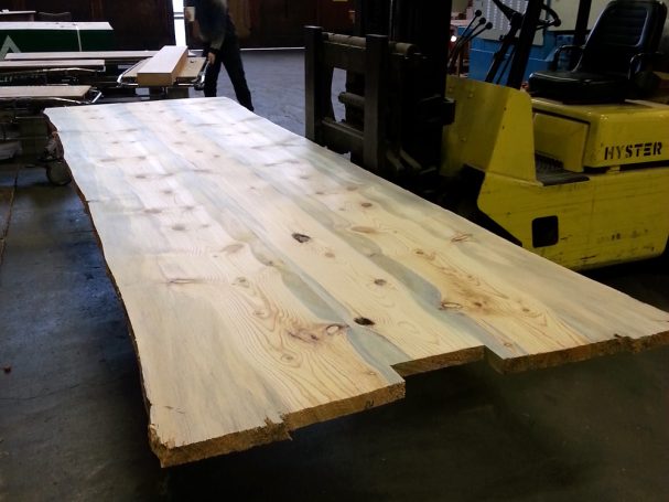 Final sanding of Custom Live Edge Blue Pine Slab Conference Table Top.